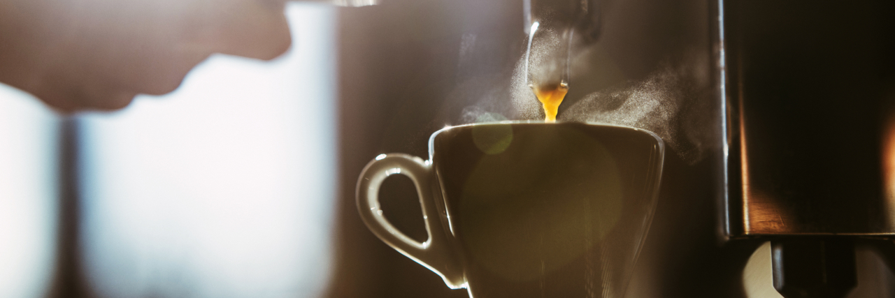 You Should Still Buy That Coffee When You Live With Financial Anxiety Woman making espresso coffee.