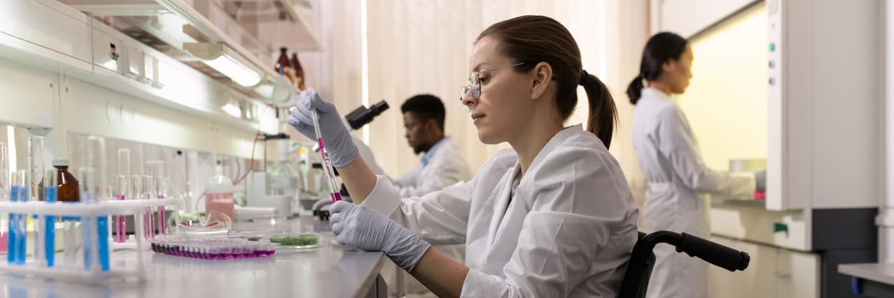 Why We Must Fight for Disability Rights and Inclusion in STEM Side view of female lab worker in wheelchair