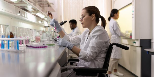 Why We Must Fight for Disability Rights and Inclusion in STEM Side view of female lab worker in wheelchair