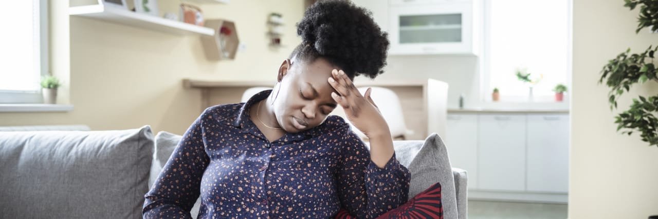 I’d Like to File a Complaint Against Ulcerative Colitis Young sick african american plus size woman with hands holding pressing her crotch lower abdomen. Medical or gynecological problems, healthcare concept. Young woman suffering from abdominal pain while sitting on sofa at home