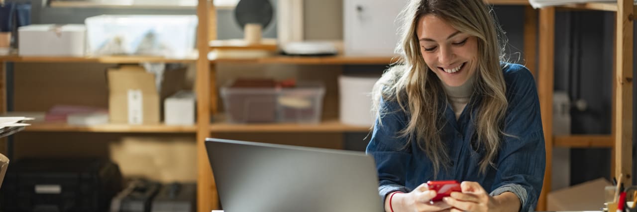 Tips for Making New Friends When You Live with Social Anxiety blonde woman on laptop smiling