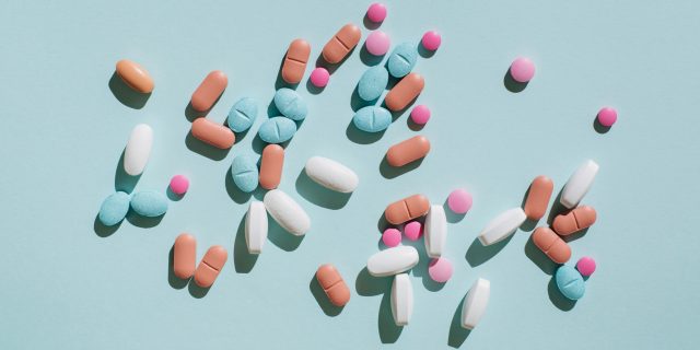 How the Roe v. Wade Reversal Affects Informed Choice for Other Treatments Colorful pills and capsules on blue background.