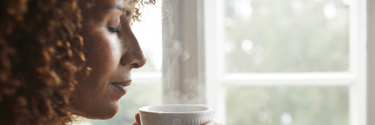 How to Manage Sensory Processing Disorder Woman drinking tea.