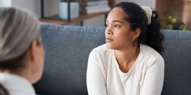 What the End of Roe v. Wade Does (and Doesn't) Mean for Your Relationship With Your Therapist Woman discussing abortion with therapist