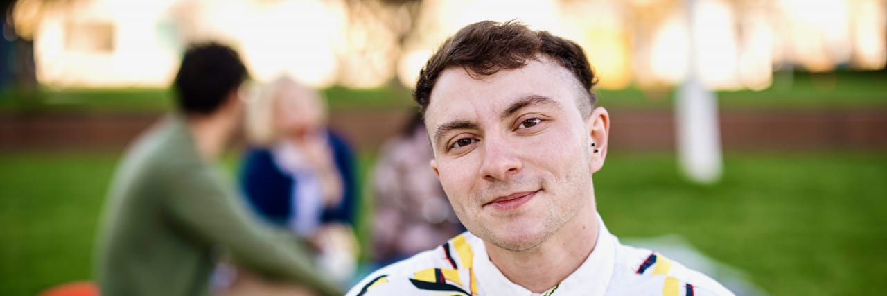 Young transgender man looking at the camera