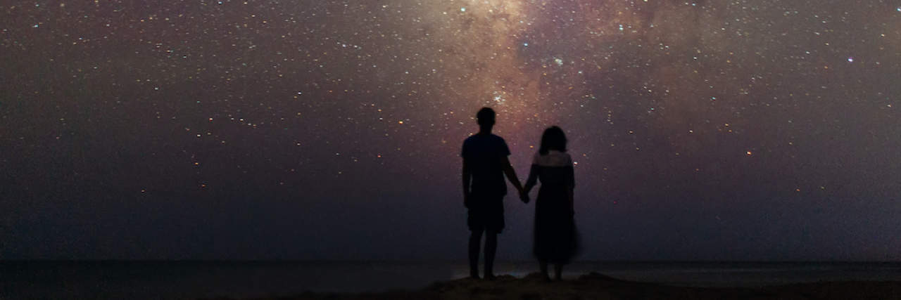 My Toolbox for Coping When Decision Fatigue and Anxiety Meet Couple walking near the sea at night under the starry sky