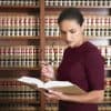 Woman reading law books