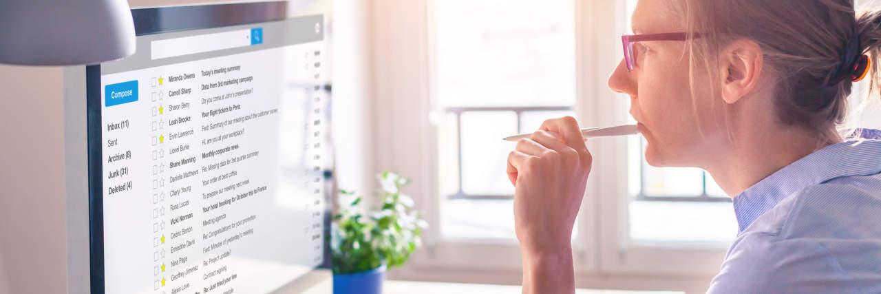 9 Tips for Writing Emails When You Live With Anxiety photo of a woman working and replying to emails