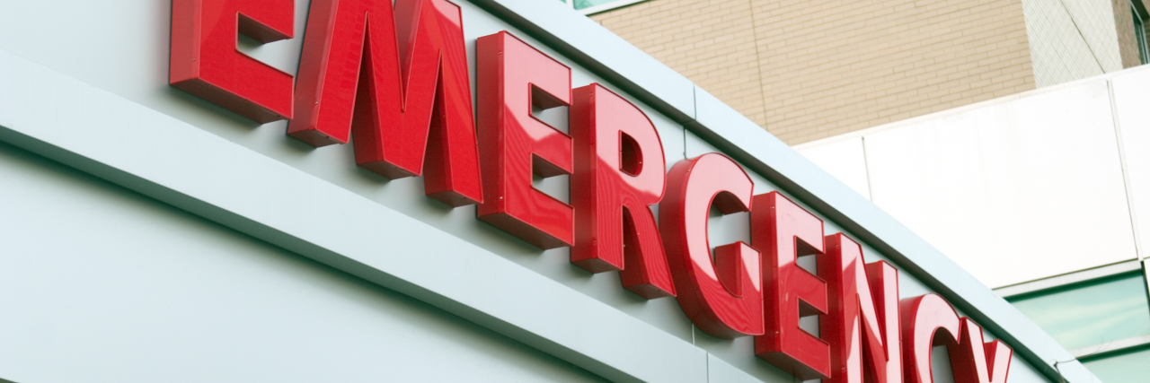 Should You Go to the Emergency Room for Fibromyalgia Symptoms? Large red EMERGENCY sign on hospital entrance.