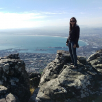 Woman standing on mountaintop