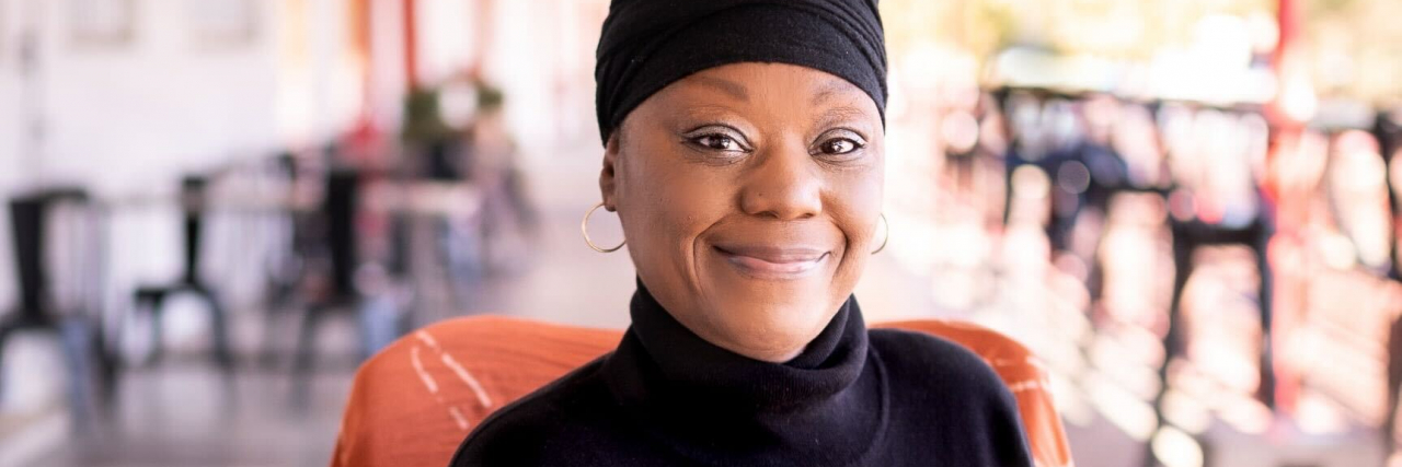 Finding Self-Love After a Chronic Illness Identity Crisis photo of the contributor smiling for the camera