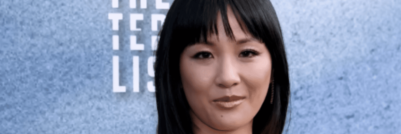 Constance Wu Shows How Harmful Adult Cyberbullying Can Be Photo of actor Constance Wu on the red carpet, an Asian American woman with dark hair and bangs