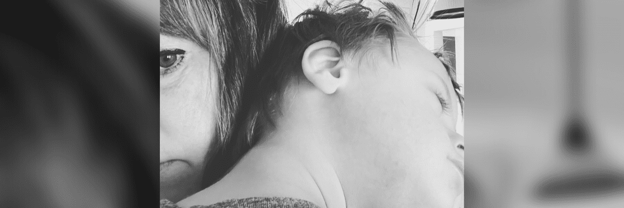 What We Carry as Parents of Kids With Disabilities Marya holding her son who has Down syndrome.