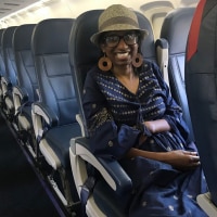 Nicole sitting on an airplane