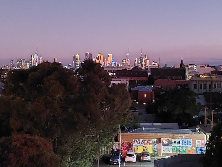 Photo from contributor's rooftop of city skyline at dusk