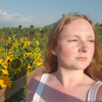 Contributor standing in front of field of sunflowers
