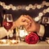 Couple with rose at a romantic dinner