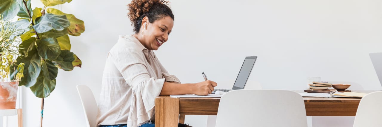 Bipolar Disorder: Am I Manic or Am I Just Feeling Excited and Productive? photo of a woman writing on a laptop
