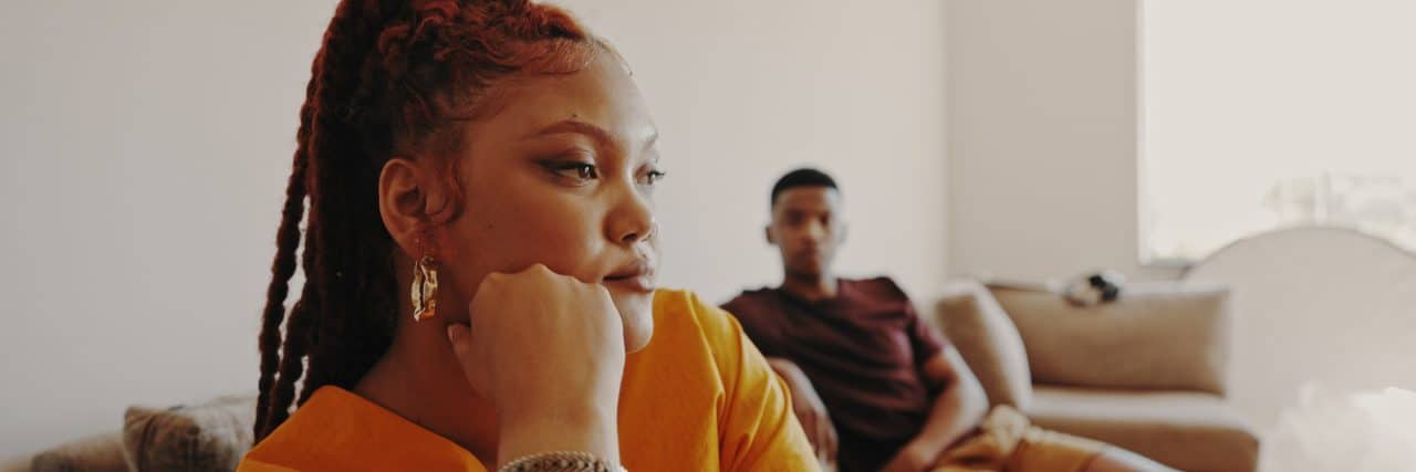 Tips for Loving Someone Who Struggles With PTSD Shot of a young woman ignoring her bf at home