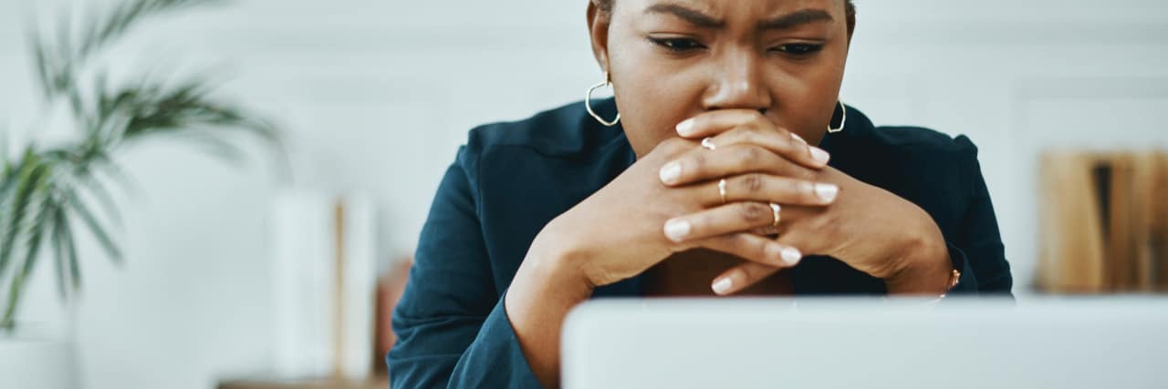 11 Affirmations for Job Seekers With Generalized Anxiety Disorder Shot of a young businesswoman frowning while using a laptop in a modern office