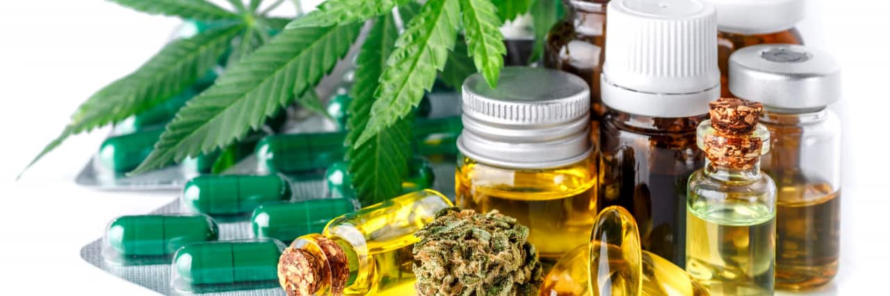 Using Marijuana for Migraine Relief: Does It Work? Green leaves of medicinal cannabis with extract oil.Medical marijuana flower buds. Hemp buds - medical marijuana