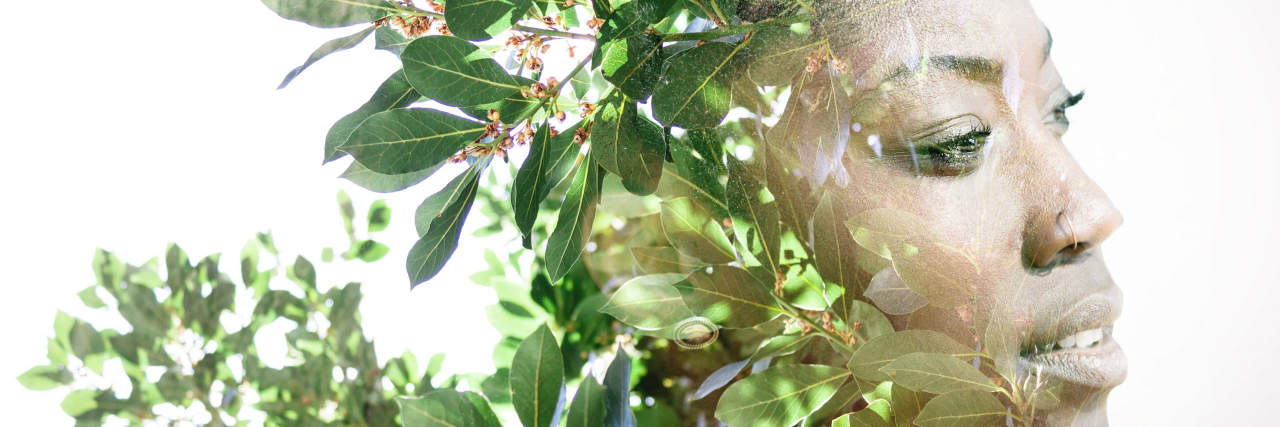 When You Don't Feel 'Disabled Enough' as Someone With Mental Illness Double exposure portrait of woman with flowers