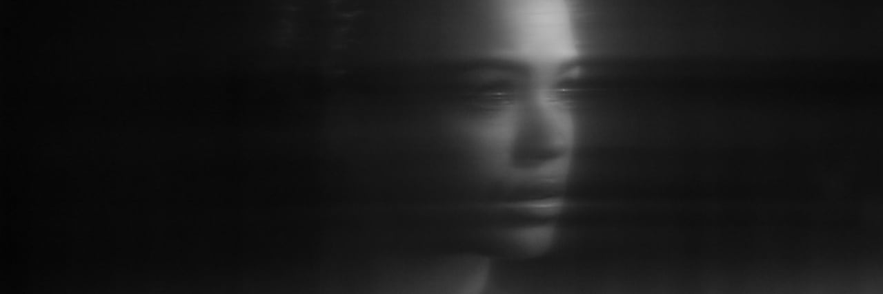 What it's Like to Have Survivor's Guilt When You Live With Depression Distorted portrait of female, reflection