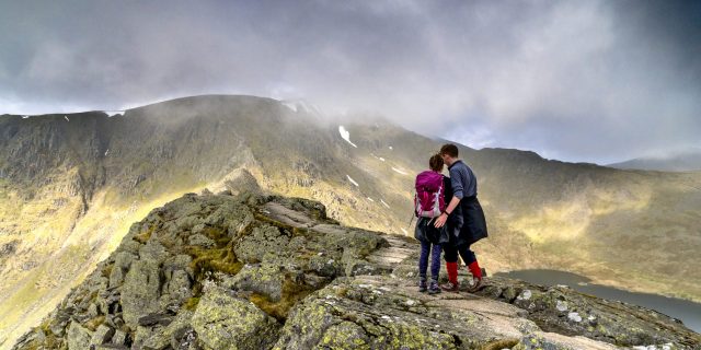 Grieving My Partner's Potential New Diagnosis — One Step at a Time Couple arm in arm walking up a hill