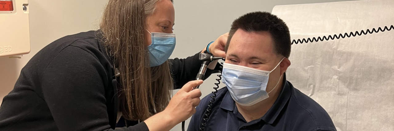 Researching the Connection Between Down Syndrome and Alzheimer's Disease John undergoes a physical