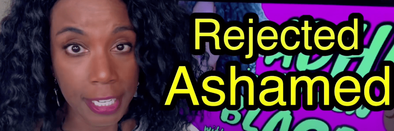 5 ADHD YouTube Channels You Should Check Out Today Screencap from a YouTube video where a Black woman with pink lipstick is on the left of the page. In big bold writing are the words "Rejected" and "ashamed" on top of a computer screen angled on the right side.