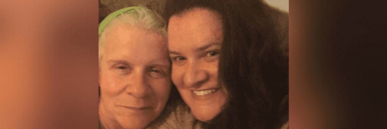 Navigating Ambiguous Loss After My Mom's Early Onset Alzheimer’s Diagnosis Contributor with her face pressed against her mother's, both smiling