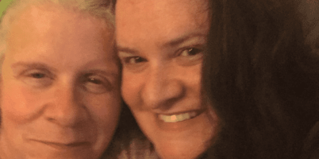 Contributor with her face pressed against her mother's, both smiling
