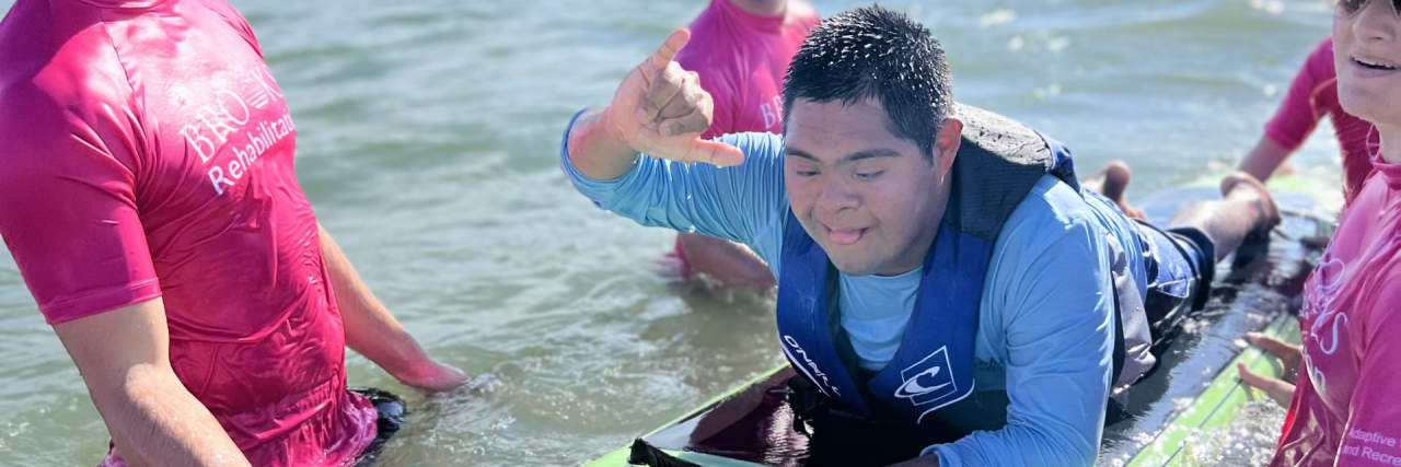 Surfing for Higher Expectations for My Son With Down Syndrome Michelle's son surfing