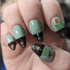 Photo of contributor's nails showing different stages of plant growing above and below surface