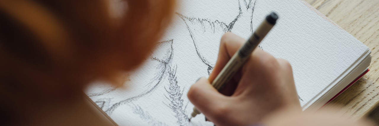 Why I Draw as Someone With Nonverbal Learning Disability and Depression Artist working at coffee shop