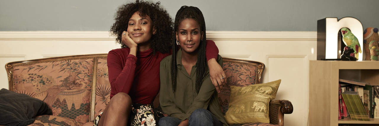 5 Things You Need to Know If You Have a Neurotypical Roommate Two young women in sofa at home