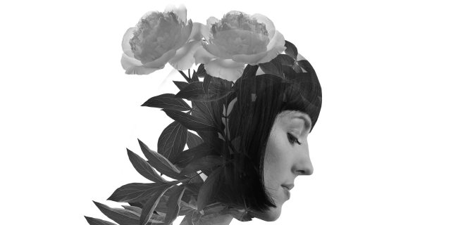 Multiple exposure of a woman and flowers
