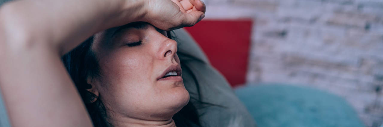 When I'm Pressured Not to Call Out Sick as a Medical Professional Woman sick in bed