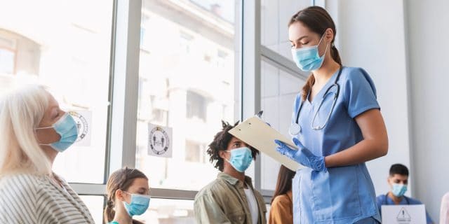 How the Collapse of Primary Care Is Impacting the Entire Health Care System Patients in busy medical waiting room.