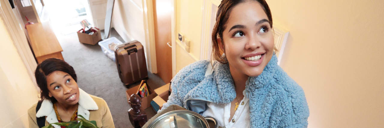 6 Things You Need to Know If You Have a Roommate With ADHD two women moving in to apartment