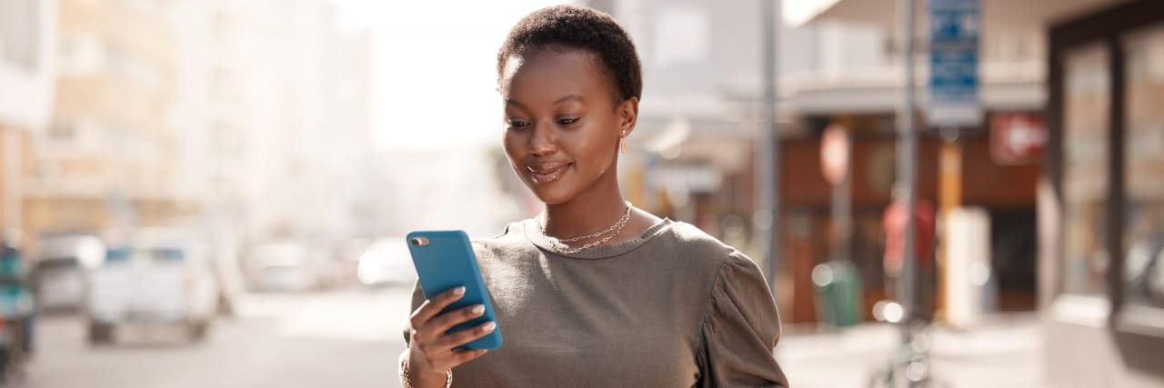 5 Ways You Can Change Your iOS Settings for Your Mental Health Shot of an attractive young woman using her cellphone outside while shopping in the city