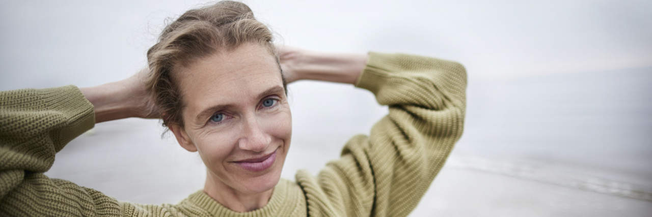 How Labels Help When I Am Overwhelmed With Complex PTSD Portrait of smiling woman on the beach