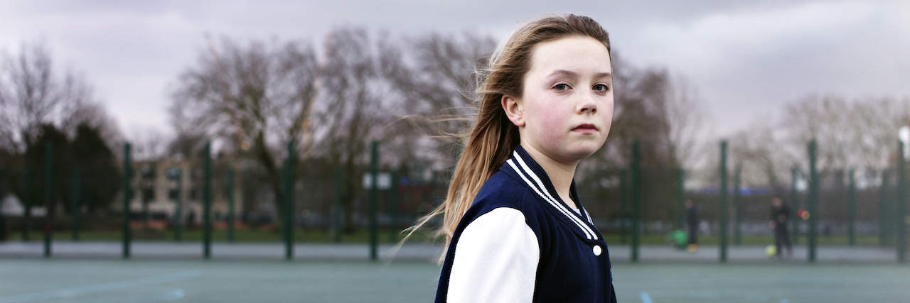 Using Hide-and-Seek as a Survival Strategy From Abuse Young girl standing on basketball court