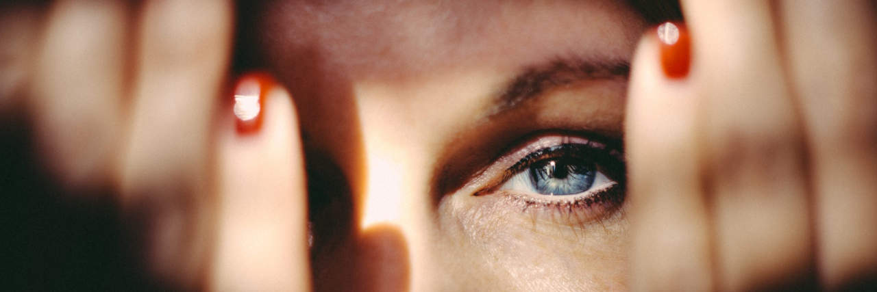 Dear Migraine, Thank You. I Mean It, I Promise! Woman emerging from behind her hands