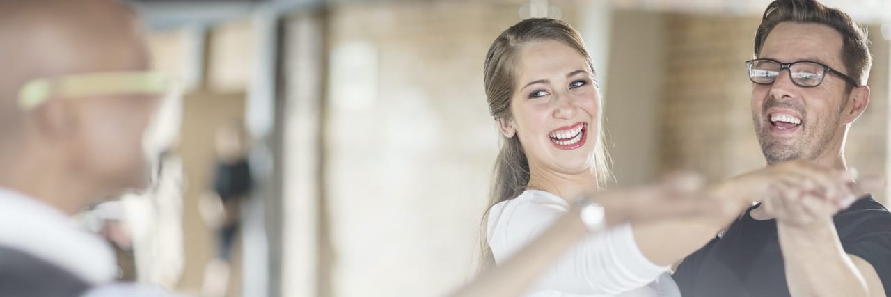 Taking Dance Lessons With My Partner With My Cerebral Palsy Smiling dance partners together in dance class with instructor