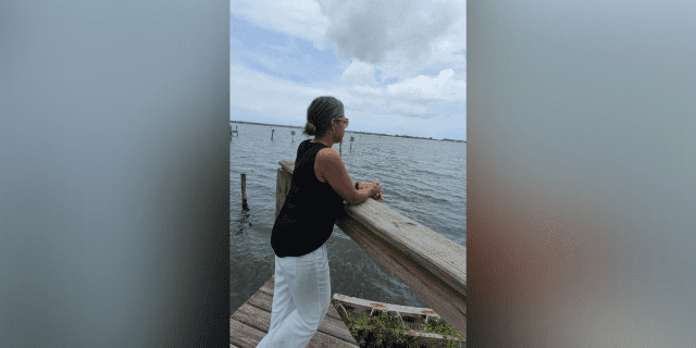 The Specialist I Wish I'd Had on My Cancer Treatment Team Photo of contributor looking out over the ocean standing on a dock
