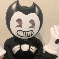 Image of boy wearing black and white "Bendy" costume