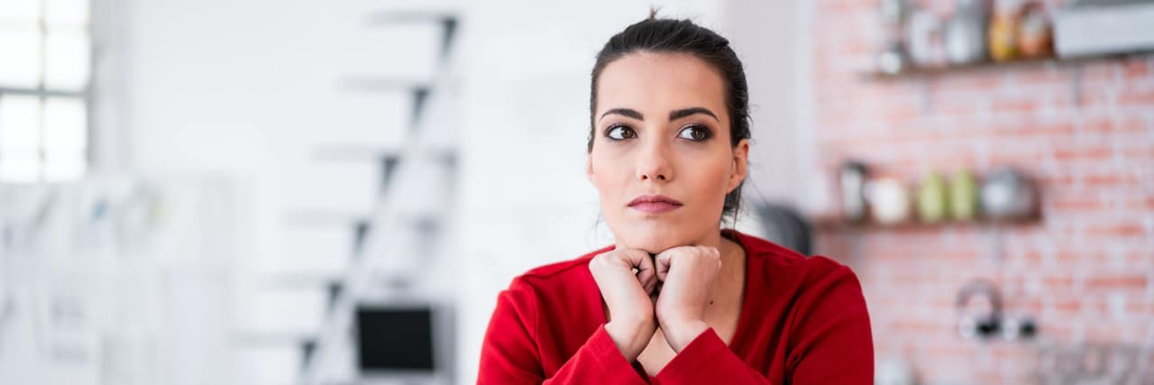 A Glimpse of What Life Is Like With Bipolar Woman in kitchen with coffee cup