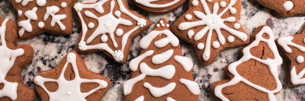 Gingerbread cookies iced with white frosting.