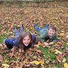 Contributors children playing in leaves